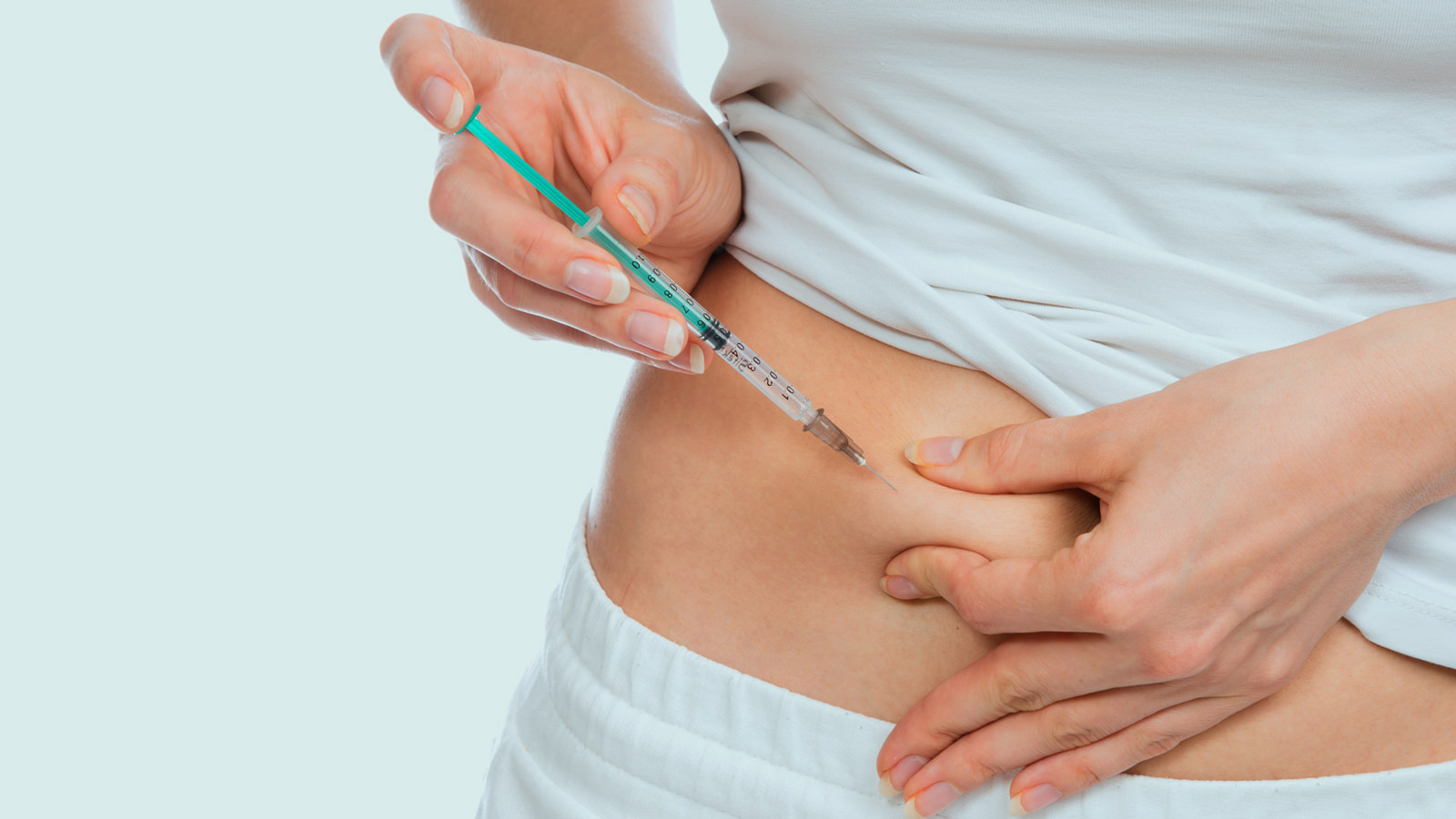 Insulinspritze am Bauch